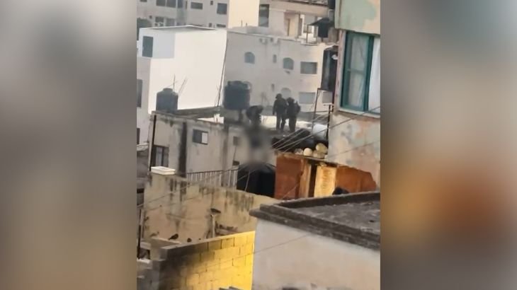 Video captures Israeli soldiers pushing dead bodies from roof